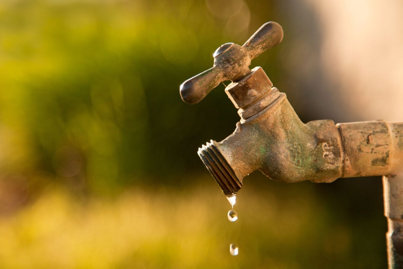 Outdoor faucet dripping water during summer