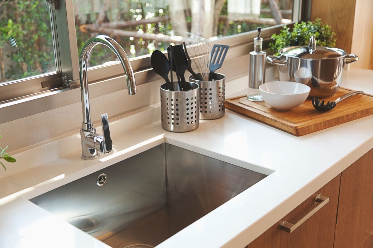 Kitchen sink and faucet on a bright countertop